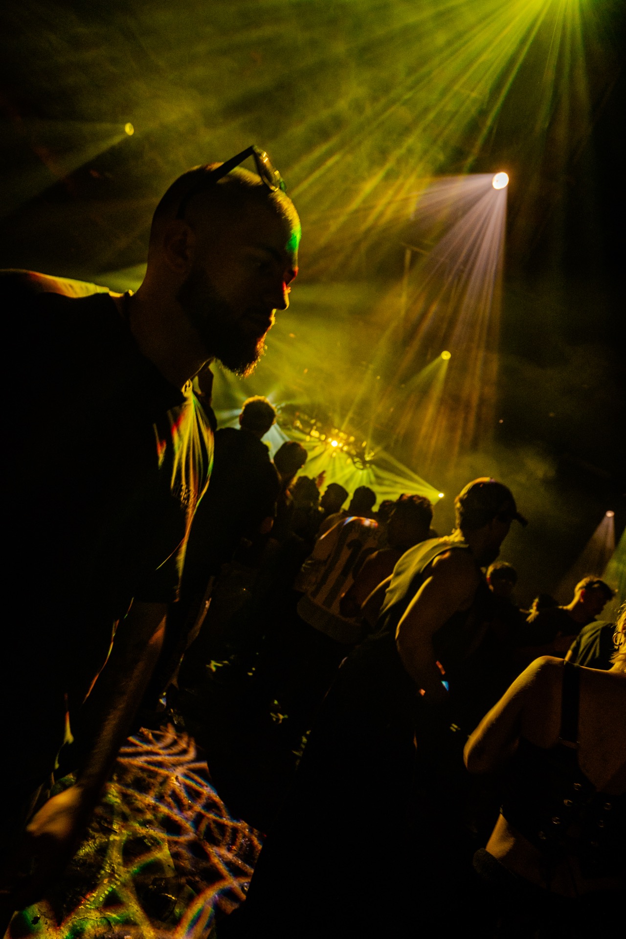 Silhouette with yellow light beams